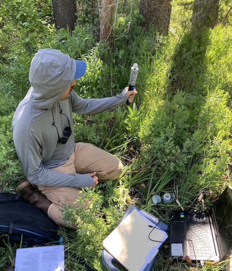 SSI Technician collecting groundwater data utilizing remote pressure transducer technology.